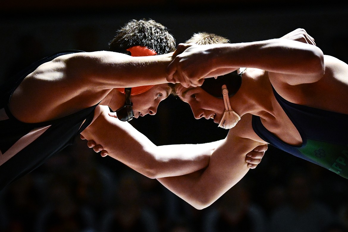 Flathead's Dane Lake and Glacier's Sylas Chapman tie up at 157 pounds at Flathead High School on Thursday, Jan. 9. (Casey Kreider/Daily Inter Lake)