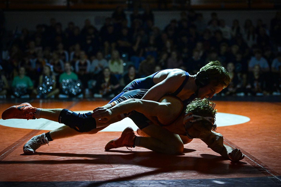 Glacier's Jerin Coles wrestles Flathead's Brett Chivers at 150 pounds at Flathead High School on Thursday, Jan. 9. (Casey Kreider/Daily Inter Lake)