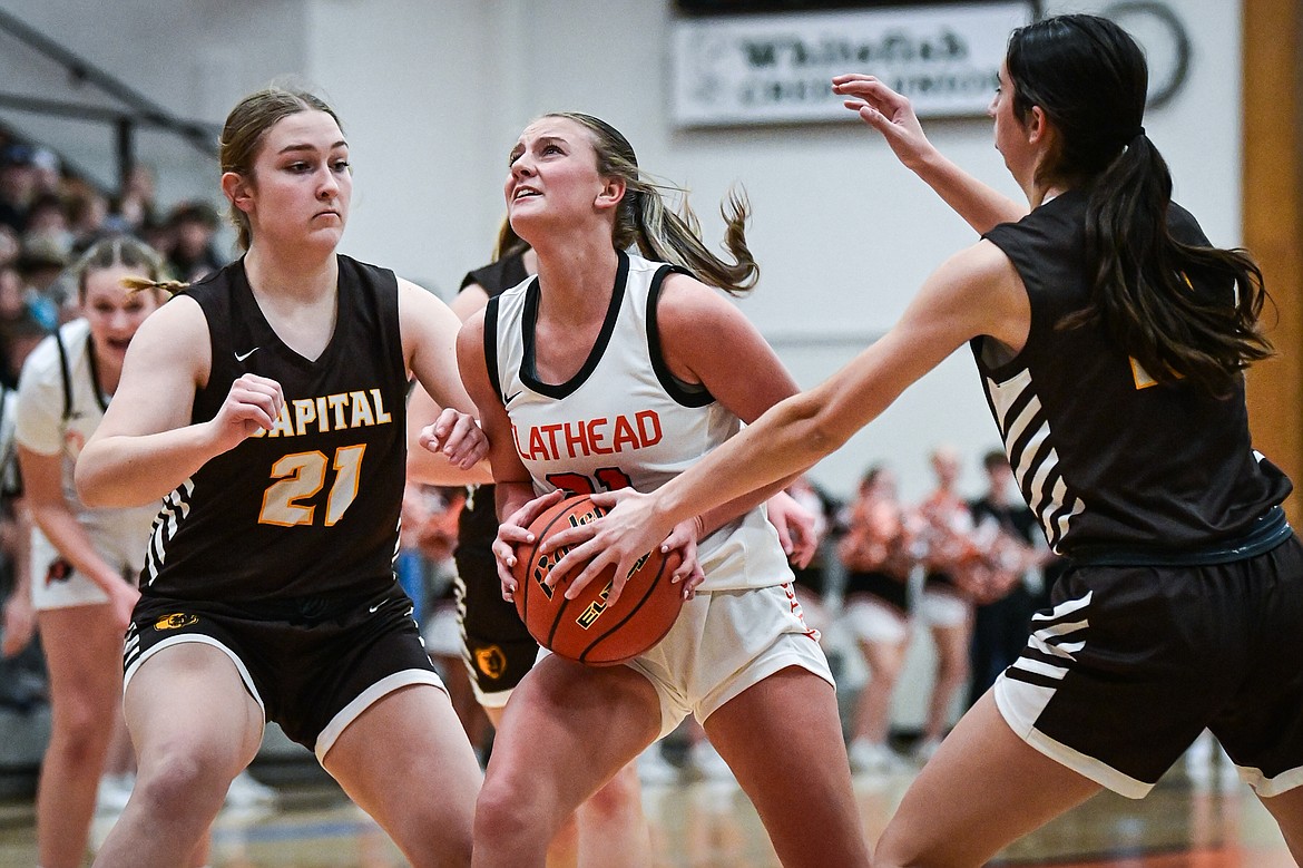 Flathead's Ava Malmin (21) drives to the basket in the first quarter against Helena Capital at Flathead High School on Friday, Jan. 10. (Casey Kreider/Daily Inter Lake)