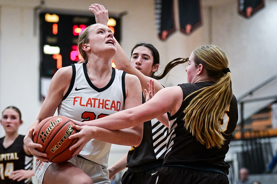 Flathead's Grace Gall (23) draws a foul on her way to the basket in the second quarter against Helena Capital at Flathead High School on Friday, Jan. 10. (Casey Kreider/Daily Inter Lake)