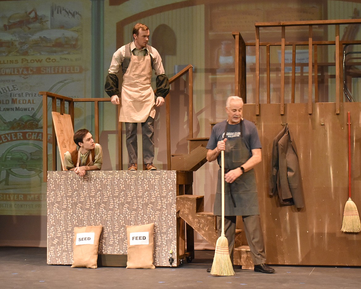 Horace Vandergelder (Paul Slager) gives instructions to his clerks Cornelius Hackl (Taggart Hodges) and Barnaby Tucker (Taylor Street) in a rehearsal of the Quincy Valley Allied Arts production of “Hello, Dolly!”