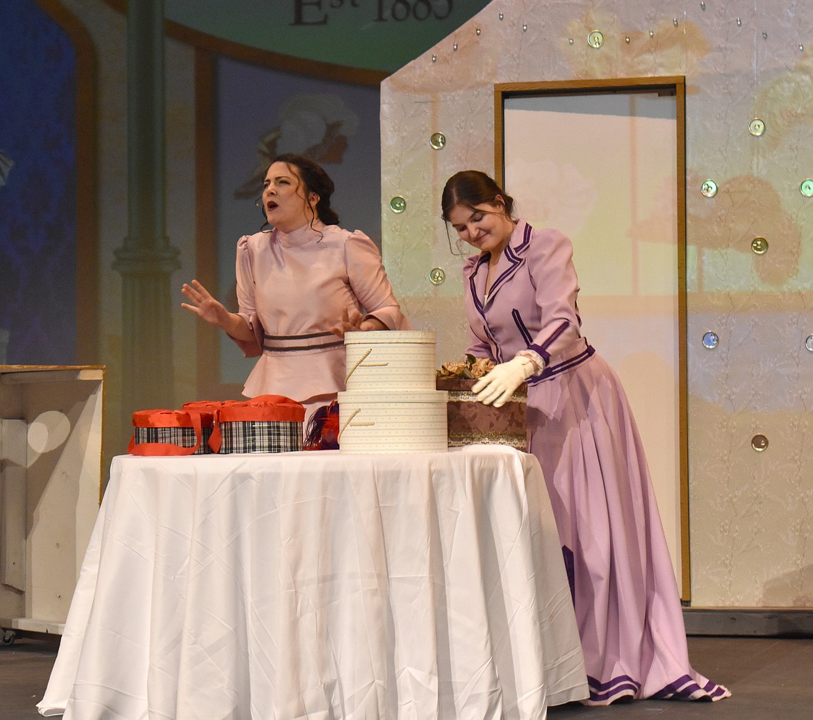 Milliner Irene Molloy, (Lydia Harris, left) explains to her assistant Minnie Fay why she’s considering marrying Horace Vandergelder, whom she doesn’t really love.