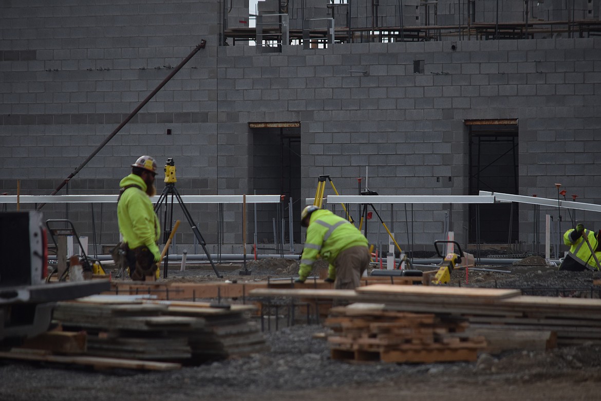 Construction workers on the site of the new Grant County Jail in late October. The jail is expected to open in about 18 months.