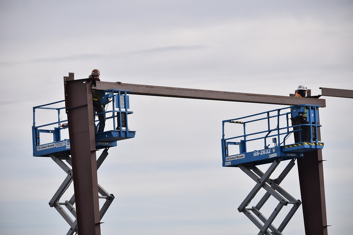 Workers place a beam in the skeleton of the new Grant County Jail in October. Grant County Sheriff Joey Kriete said last week that construction is going at a rapid clip.