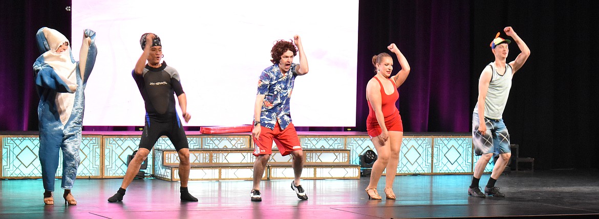 Tyler Wallace, center, gets his Beach Boys vibe on with dancers – and a shark – from the Utah Dance Company.