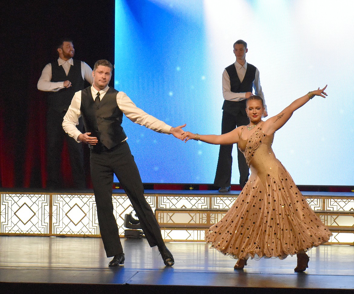 Morgan Fife, left, does an elegant foxtrot with Utah Dance Company partner Cassidy Watson at Dancing with the Moses Lake Stars Saturday.