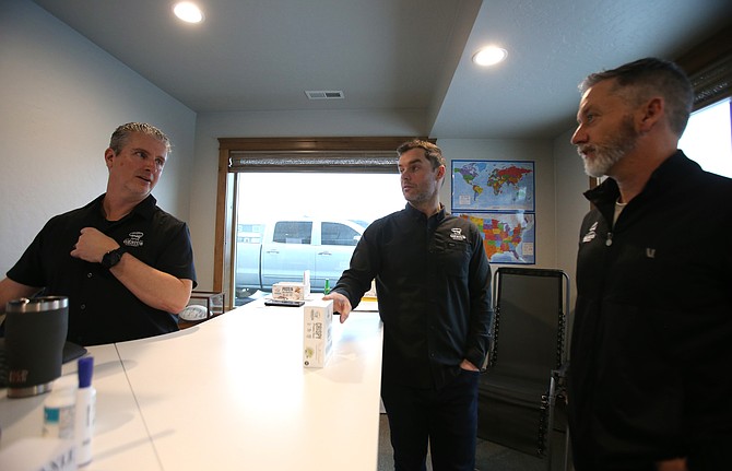 Genius Gourmet Chief Operating Officer Tom Lunneborg, left, Vice President of Sales James Vas Dias, center, and President Pete Vas Dias discuss products Jan. 8 in their Hayden office. The company that launched in 2019 in Coeur d'Alene is making waves through platforms such as QVC and Instacart.