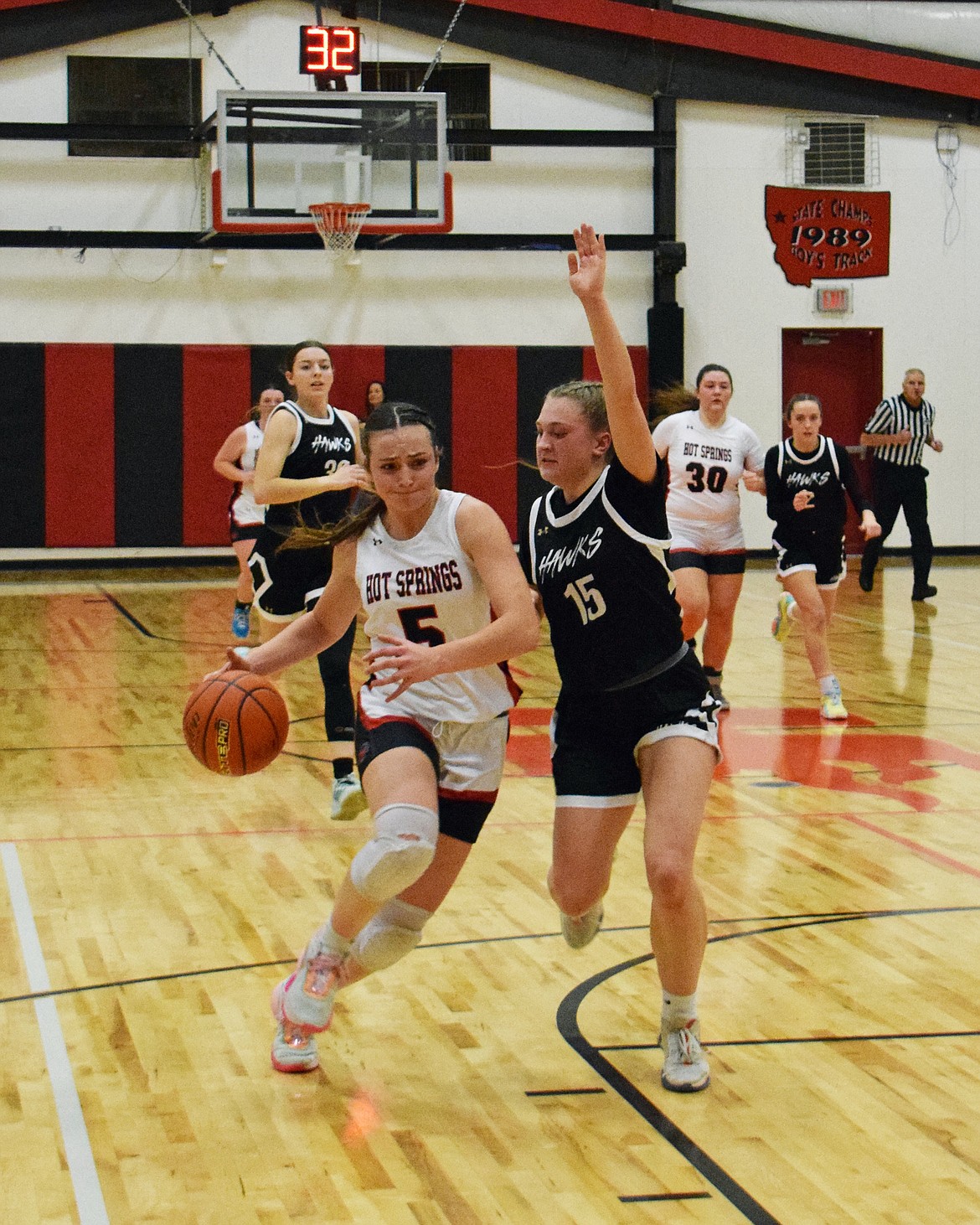 Hot Springs guard Kara Christensen dribbles around a Seeley Swan player during their game Saturday night in Hot Springs.  (Photo by Jen Christensen)