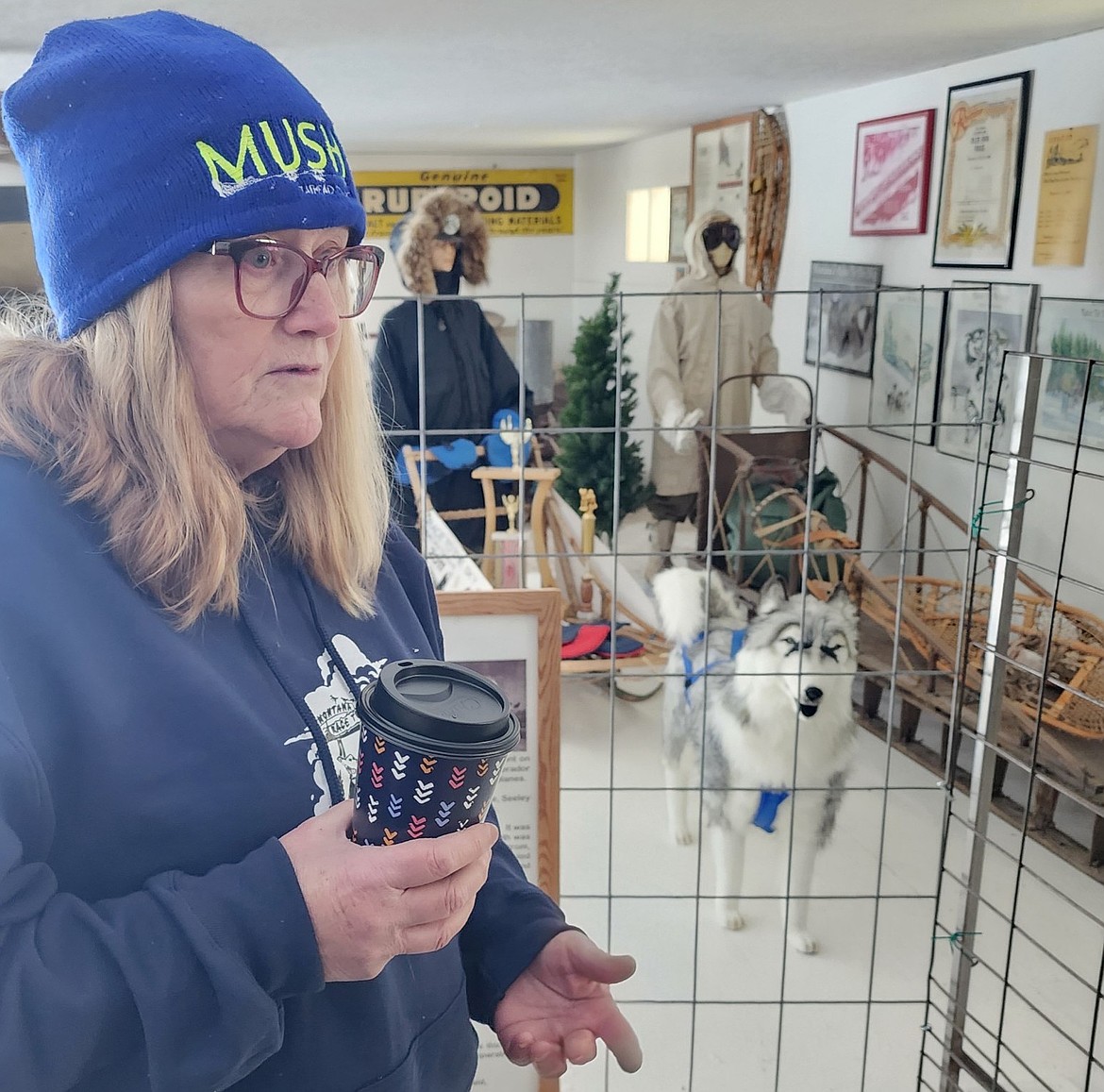 Pam Beckstrom of Adanac Sleds and Equipment showcases some of the items in the Miracle of America Museum's new exhibit honoring Montana mushers and the Race to the Sky. (Berl Tiskus/Leader)