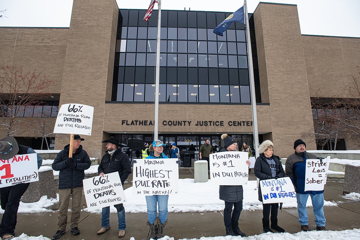 Picketers gather outside Flathead County Justice Center in Kalispell to advocate for harsher DUI laws and sentencing Wednesday, Jan. 8 proceeding Dal Segall’s arraignment the next morning. (Avery Howe/Bigfork Eagle)