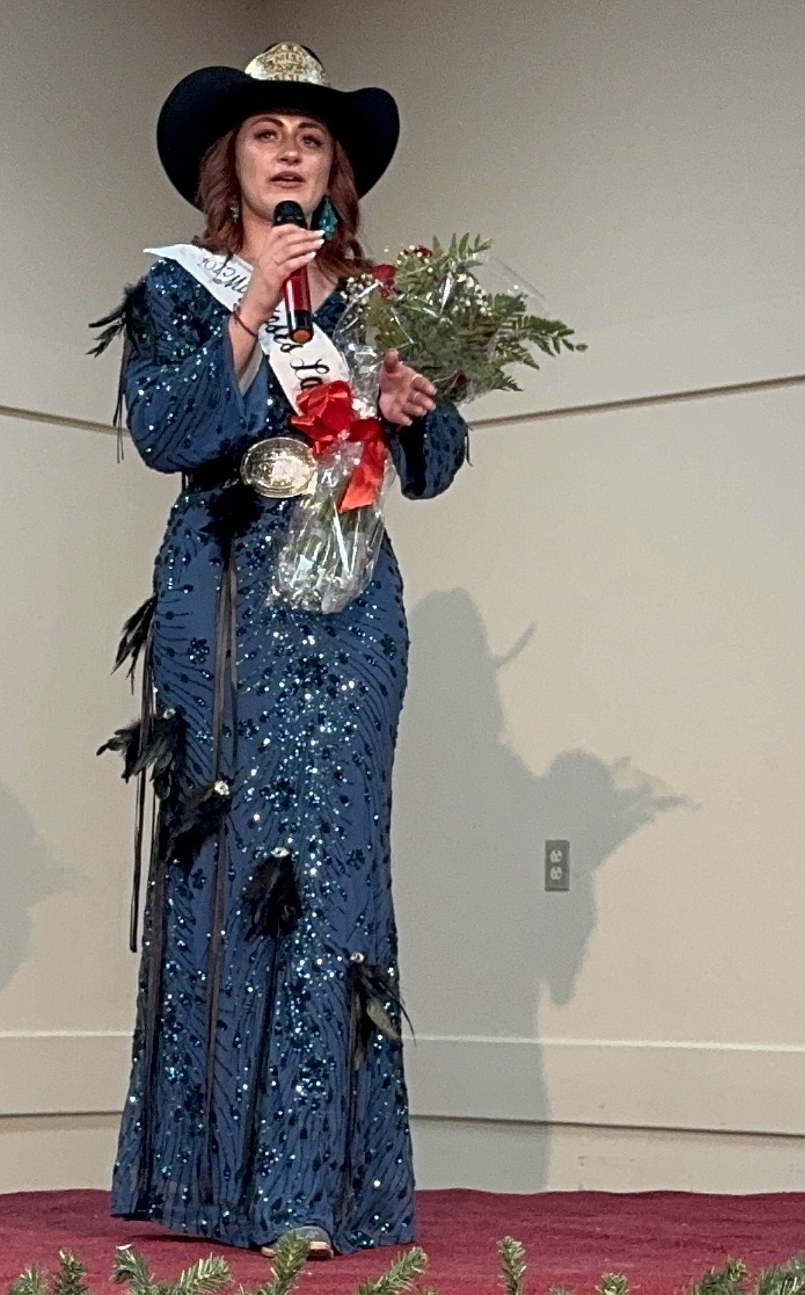 Miss Moses Lake Roundup Rodeo 2025 Kaylee Stump takes the microphone at the rodeo queen pageant in November. Stump is a 2022 graduate of Ephrata High School.