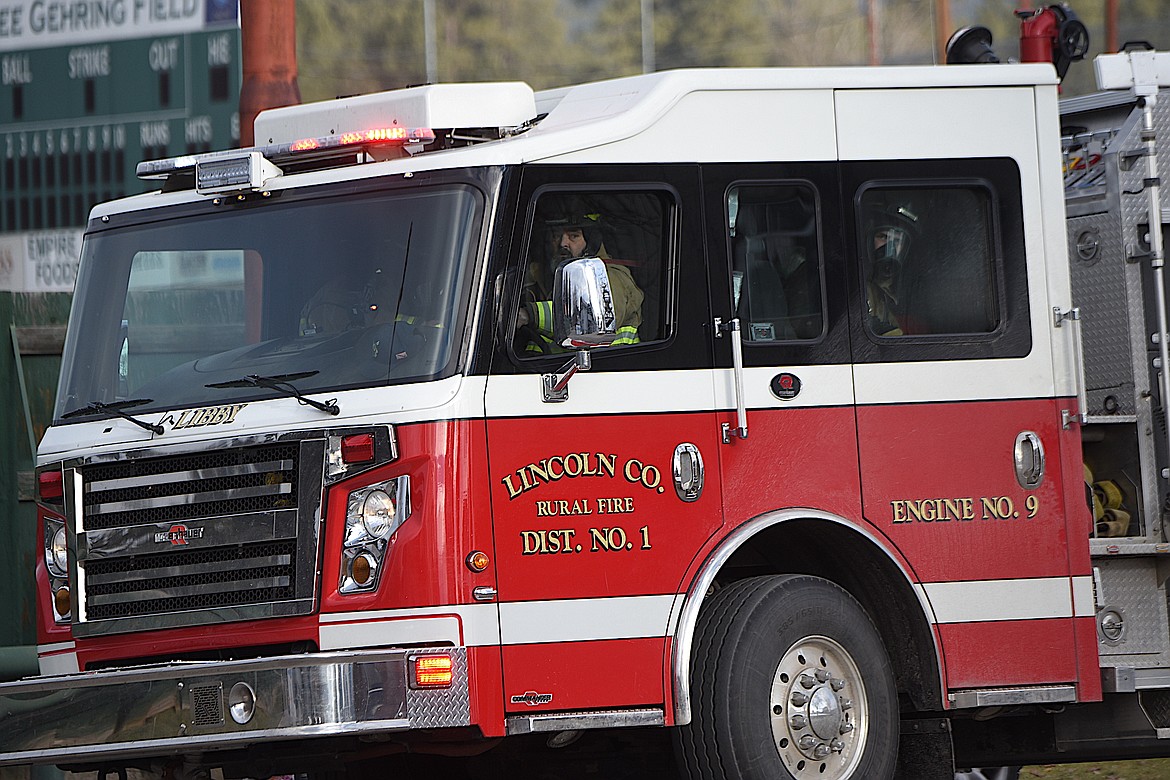 Libby Volunteer Fire Department Engine 9 arrives on the scene of an apartment fire Tuesday afternoon on Main Avenue in Libby. (Scott Shindledecker/The Western News)