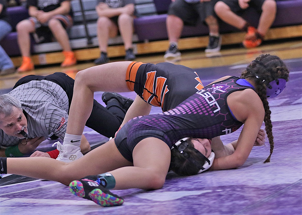 Polson's Gracie Hammer defeated Ronan’s Marie Cheff at 110 via pin at 110 pounds during last Tuesday's dual action between the rival schools. (Bob Gunderson photo)