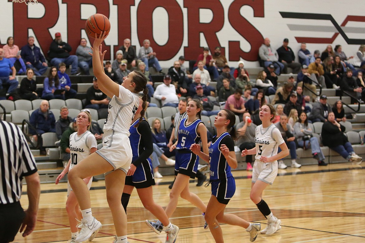 Almira/Coulee-Hartline junior Peyton Roberts, left, drives toward the rim during a game against the Valley Christian Panthers on Tuesday.