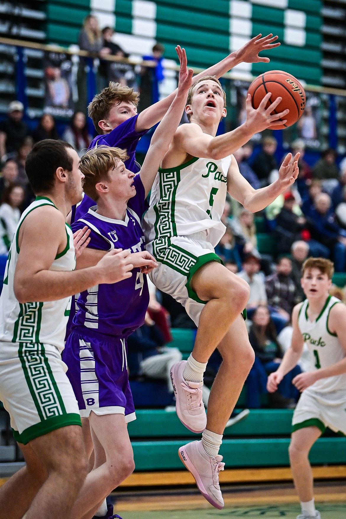Glacier's Easton Kauffman (5) drives to the basket in the first quarter against Butte at Glacier High School on Friday, Jan. 17. (Casey Kreider/Daily Inter Lake)