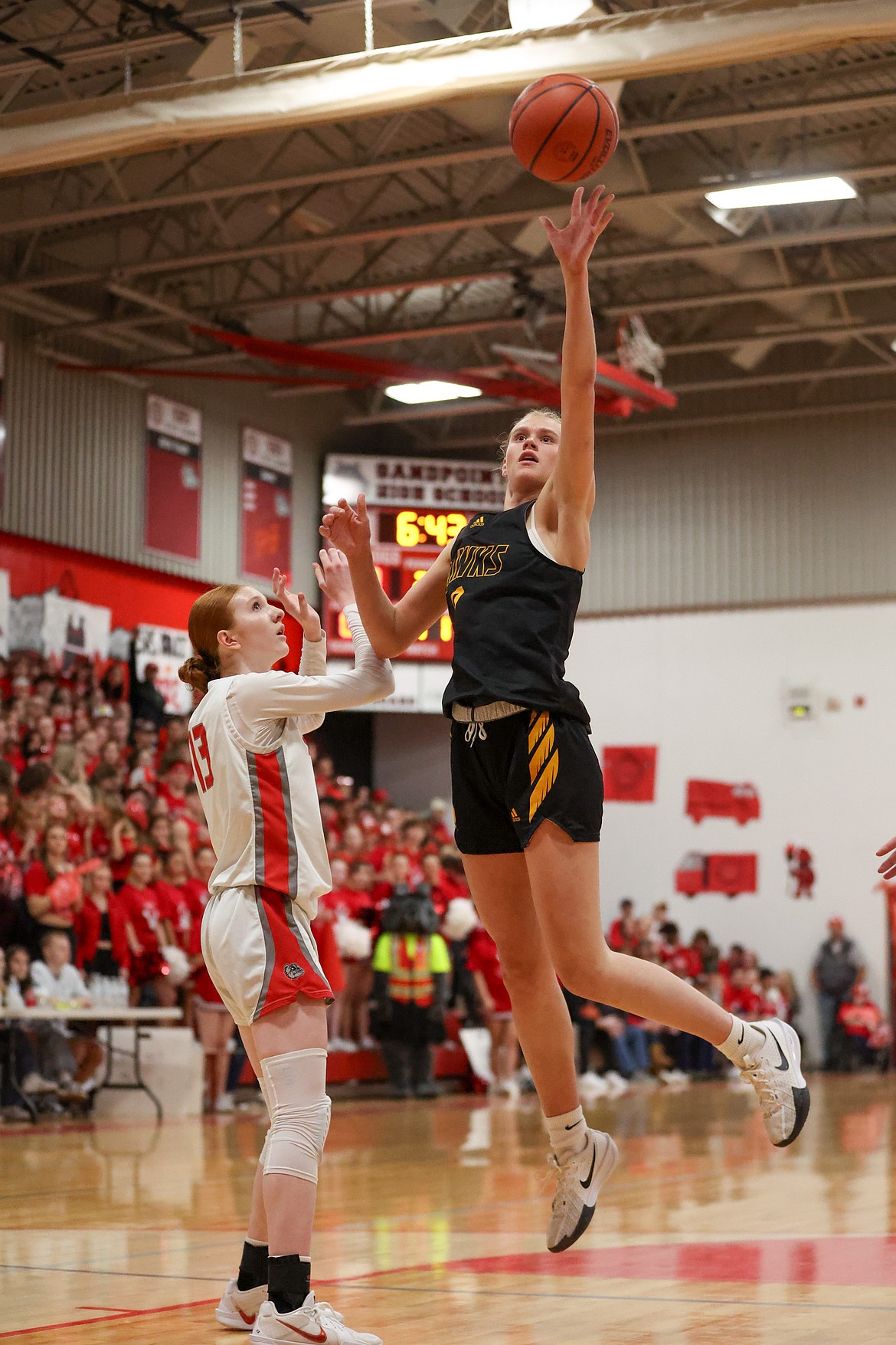 JASON DUCHOW PHOTOGRAPHY
Lakeland senior Landree Simon shoots over the defense of Sandpoint's Brecken Mire during Friday's Battle for the Paddle spirit game in Sandpoint.