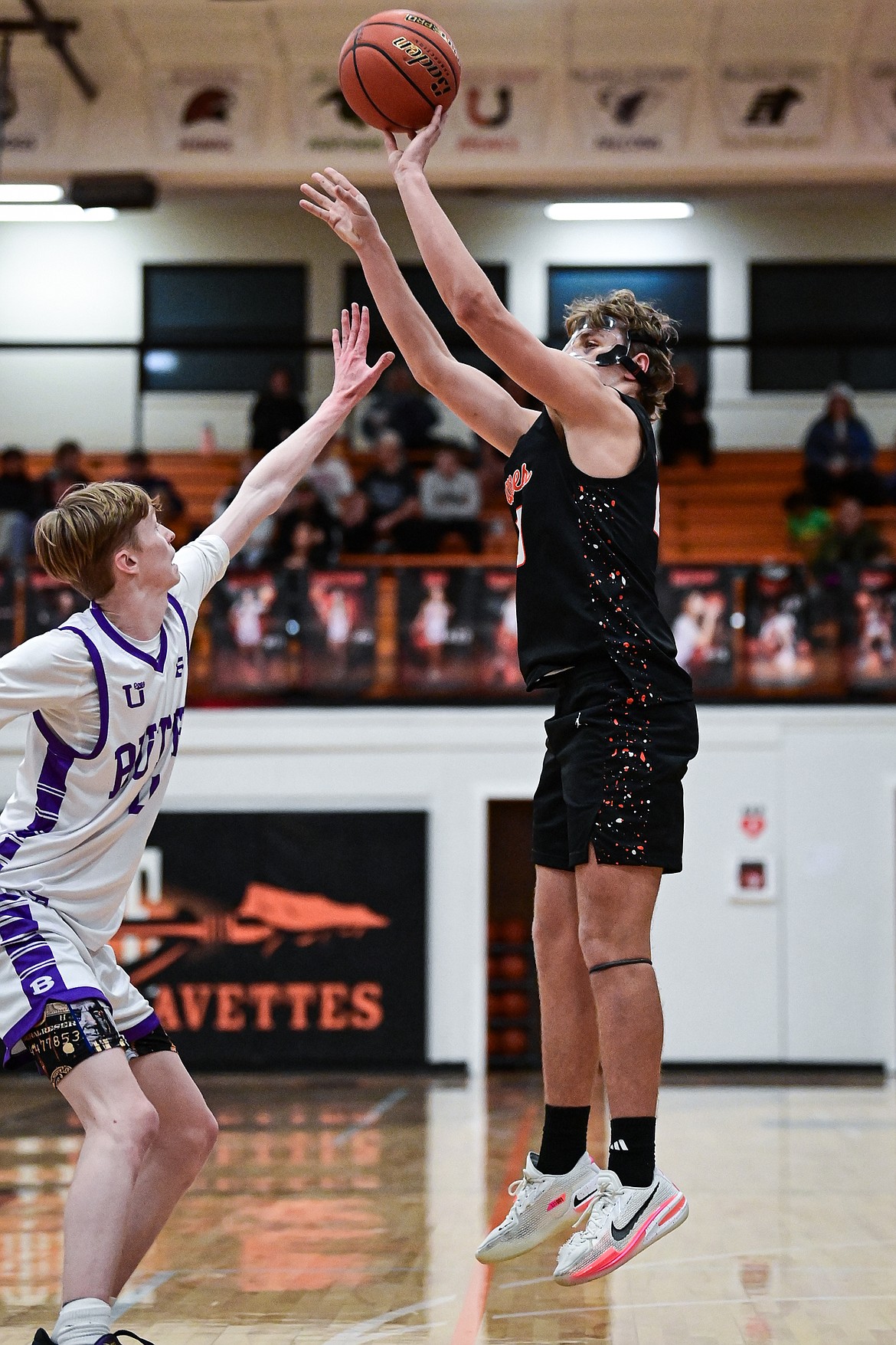 Flathead's Eli Coopman (20) knocks down a three in the third quarter against Butte at Flathead High School on Saturday, Jan. 18. (Casey Kreider/Daily Inter Lake)