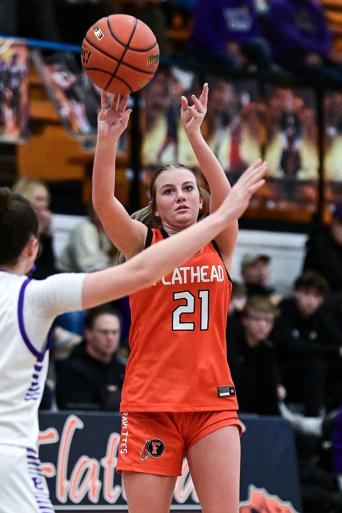 Flathead's Ava Malmin (21) shoots a three in the third quarter against Butte at Flathead High School on Saturday, Jan. 18. (Casey Kreider/Daily Inter Lake)
