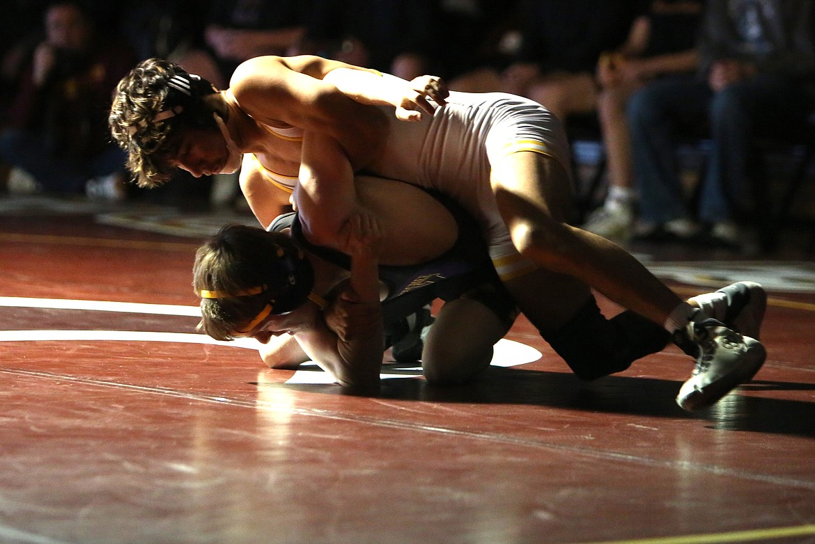 Moses Lake junior Ian Garza, top, wrestled in the 120-pound class at Thursday’s dual against Wenatchee, pinning his opponent in the first round.