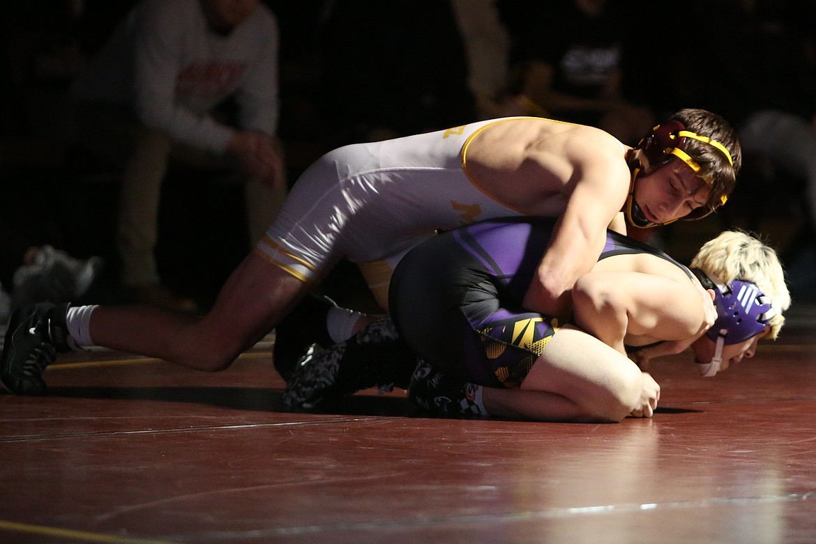 Maverick sophomore Trenton Vasquez, top, won his match in the 144-pound class in a 10-1 major decision.