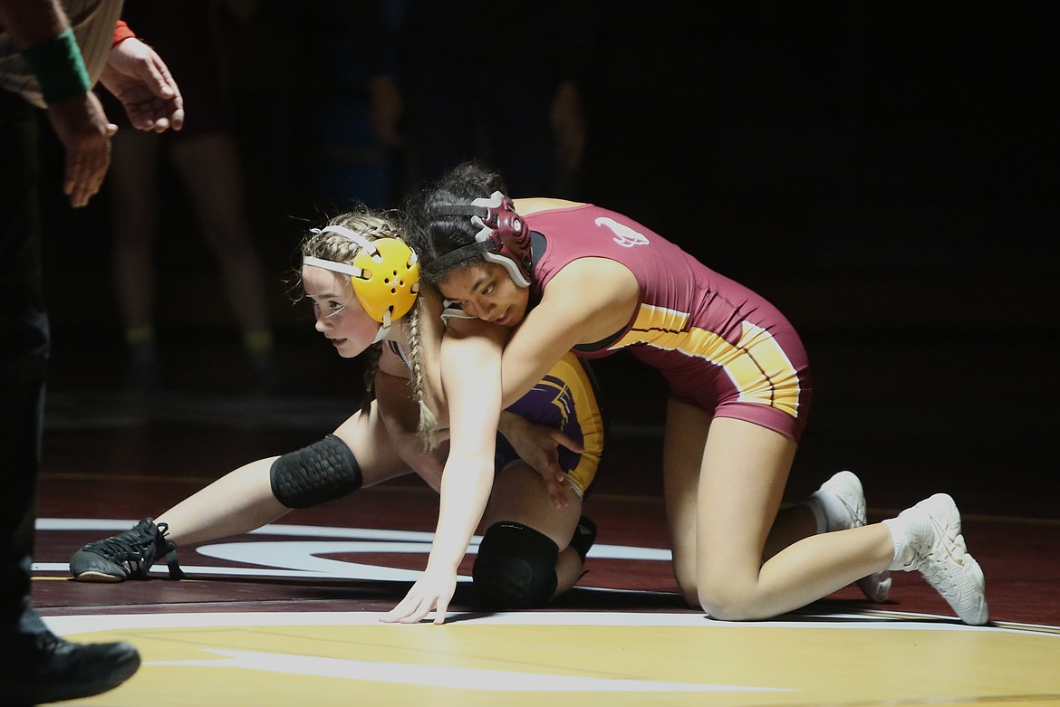 Maverick senior Grace Martinez, right, works to flip her opponent on her back during Thursday’s dual against Wenatchee. Martinez won the match with a 19-4 technical fall.