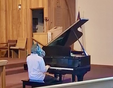 Joel Carpenter performs “The Smiling Hippopotamus” at the Celebrate Music Festival Saturday, sporting a hippopotamus mask. The theme was “Parade of the Animals,” and many performers dressed in costume to match their pieces.