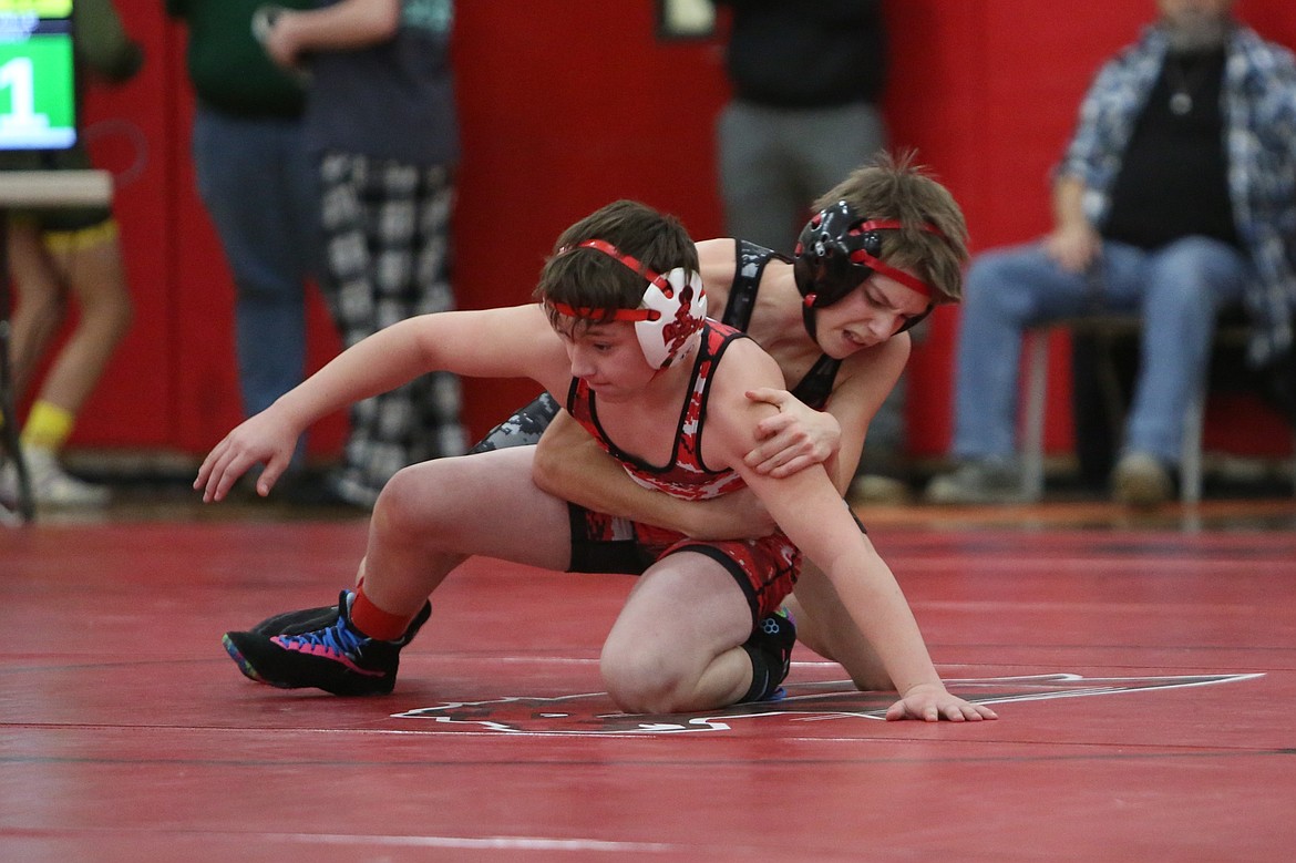 LRS freshman Carter Brierly, background, earned a third-place finish in the 106-pound weight class at the Bronco Invite in Ritzville on Saturday.