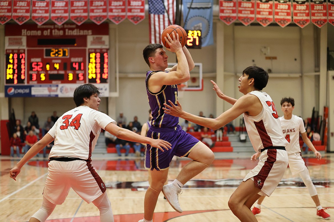 Pirate Holden Emerson goes up for a shot against the Browning Indians. (Niki Graham photo)