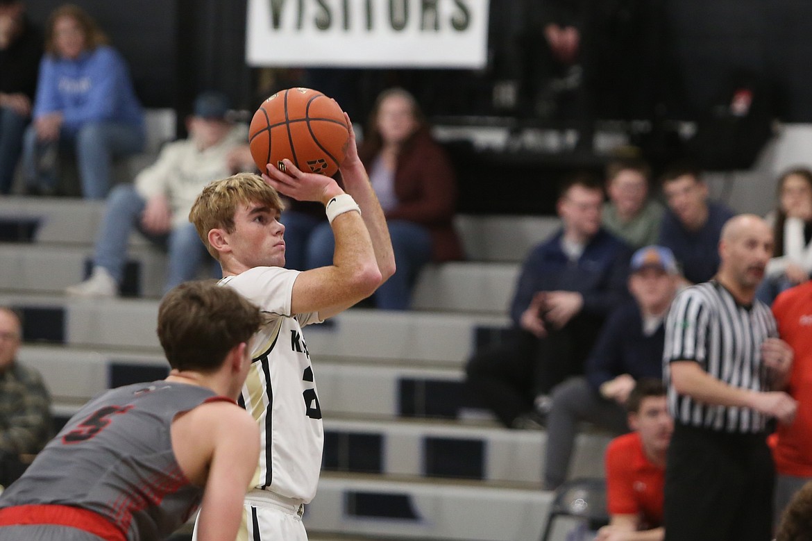 Royal senior Jackson Larsen, in white, attempts a free throw during a Jan. 3 game against Riverside.