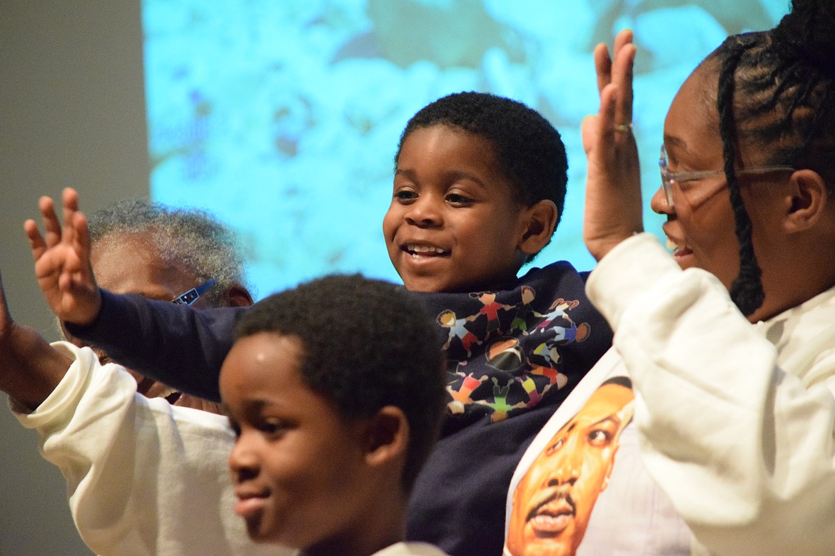 One of the Dreamers in Action waves to the crowd at the beginning of the Honoring the Life and Legacy of Dr. Martin Luther King, Jr. celebration.