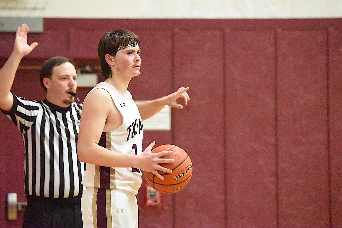 Troy's Emerson Downey prepares to inbound the ball during a home game Tuesday, Jan. 21, 2024, against Eureka. (Scott Shindledecker/The Western News)