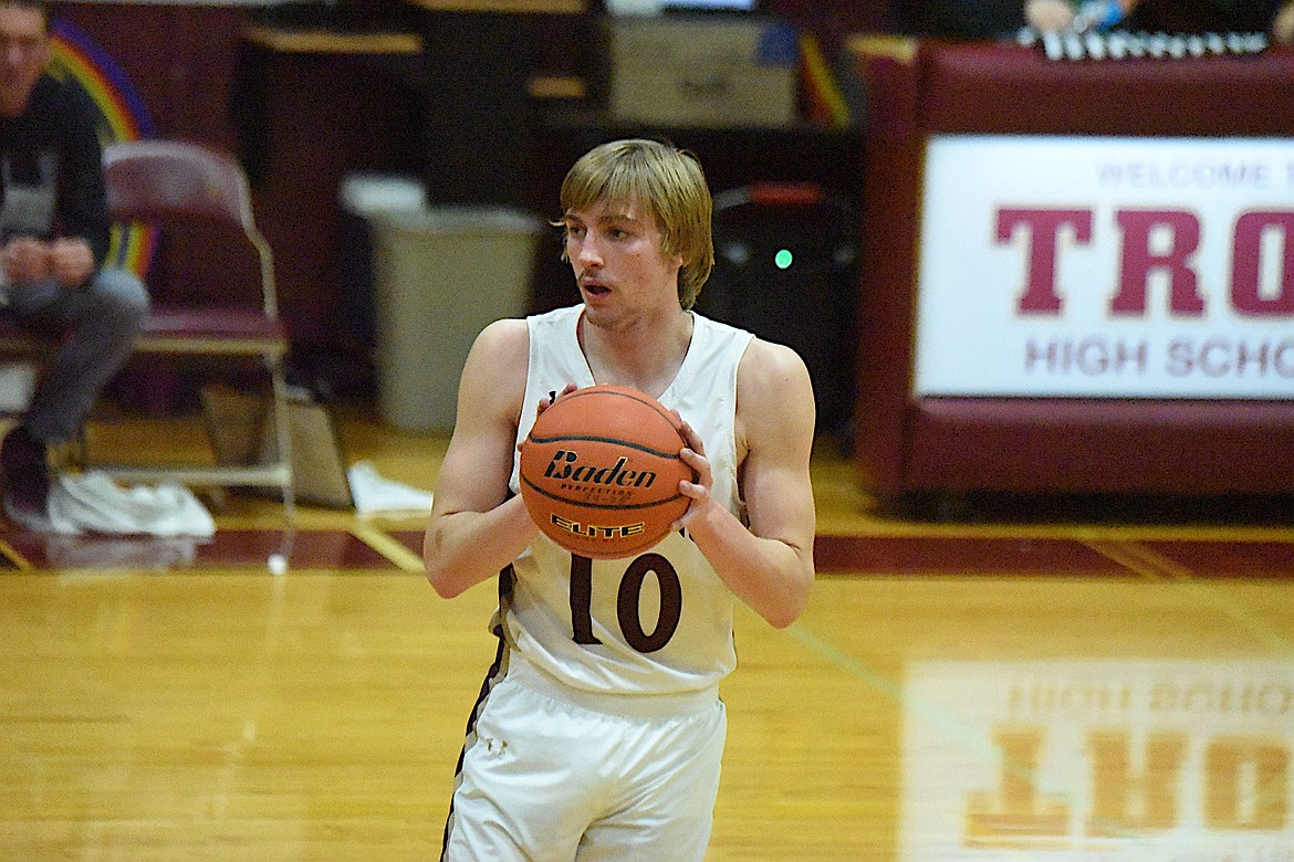 Troy's Kempton Sloan passes the ball to a teammate during a home game Tuesday, Jan. 21, 2024, against Eureka. (Scott Shindledecker/The Western News)