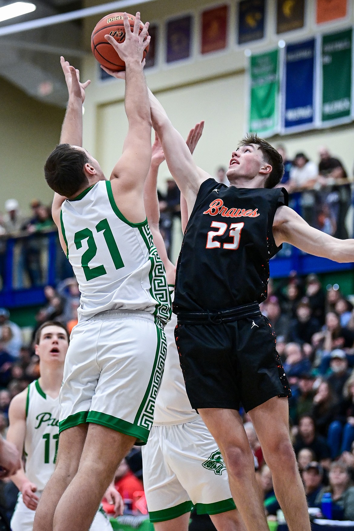 Flathead's Noah Sonju (23) battles for a rebound with Glacier's Slate Burrington (21) in the fourth quarter at Glacier High School on Friday, Jan. 24. (Casey Kreider/Daily Inter Lake)
