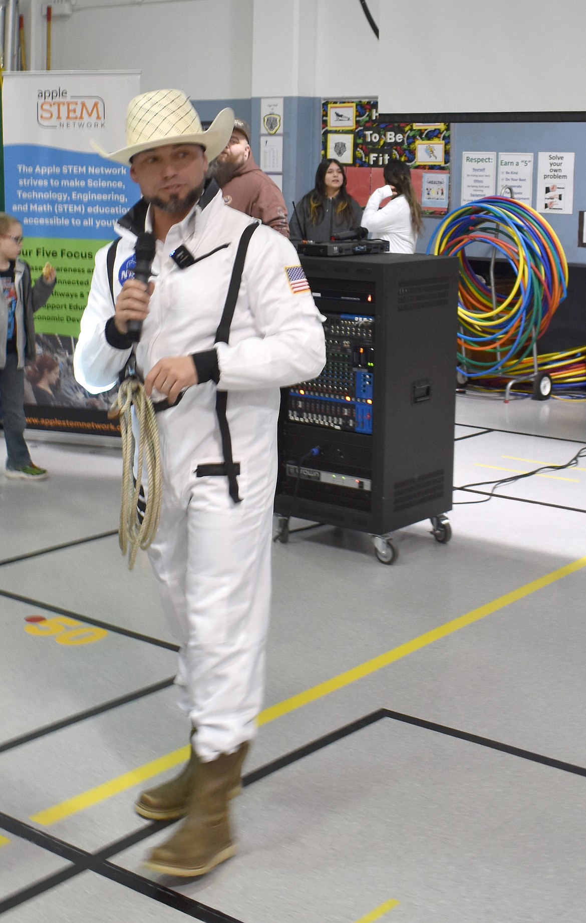 AeroTec President Justin Morigeau, the Aerospace Cowboy, challenges students at the NCW Tech Alliance STEM event to decide which careers involve science, technology, engineering or math.