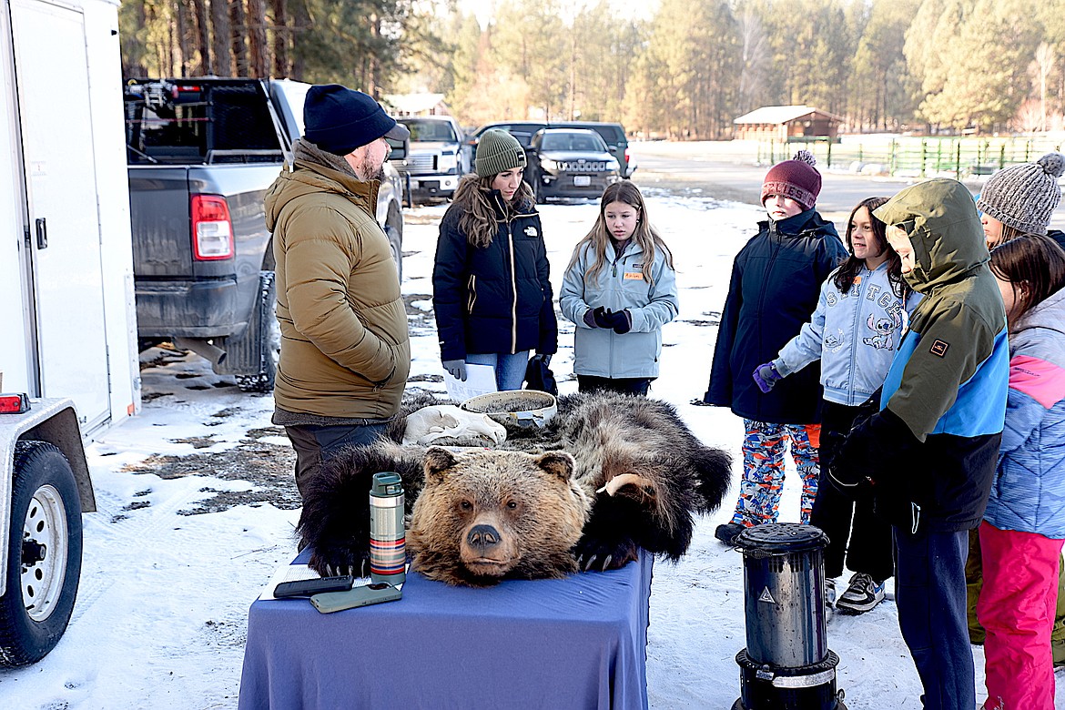 Montana Fish, Wildlife and Parks Bear Specialist Garrett Tovey gives a presentation on bears during the Friends of Scotchman Peaks Wilderness Libby Winter Tracks event Friday, Jan. 24, 2025, at J. Neils Memorial Park. (Scott Shindledecker/The Western News)