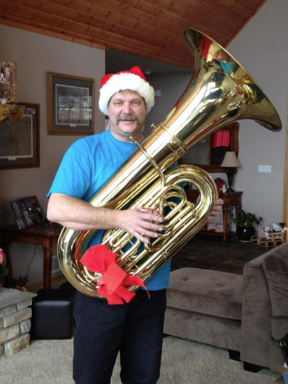 Coeur d'Alene High School Class of 1984 grad John Tindall is seen here with the tuba he played while in high school. Tindall died in October 2022. The tuba has been donated to the Coeur d'Alene High band program.