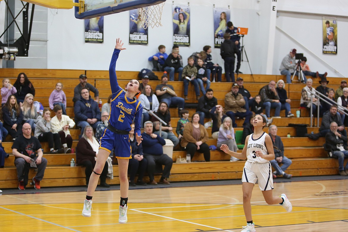 Wilson Creek freshman Kaydence Leslie (2) lays the ball in for a basket during the first quarter against MLCA/CCS on Thursday.