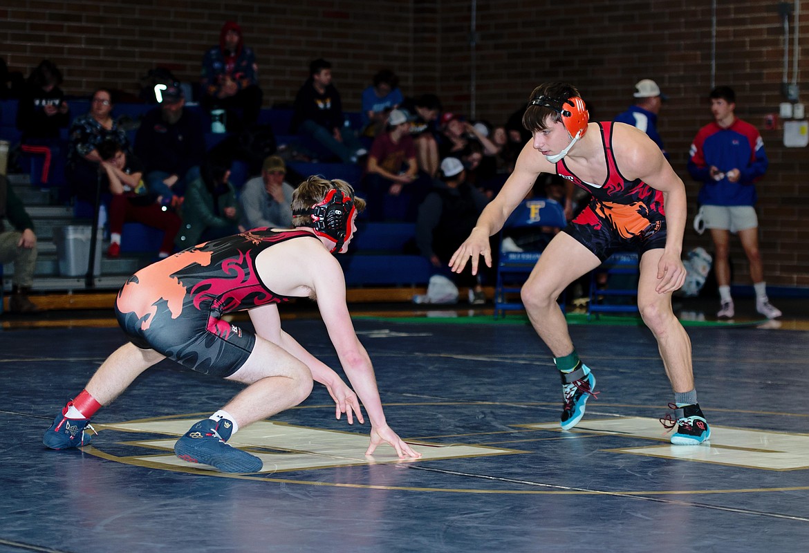 Plains-Hot Springs teammates Gavin Schrenk (right) and Andrew Waterbury square off in a 132-pound match at the Ted Kato Memorial tournament this past Saturday in Thompson Falls. (Photo by Teresa Waterbury)