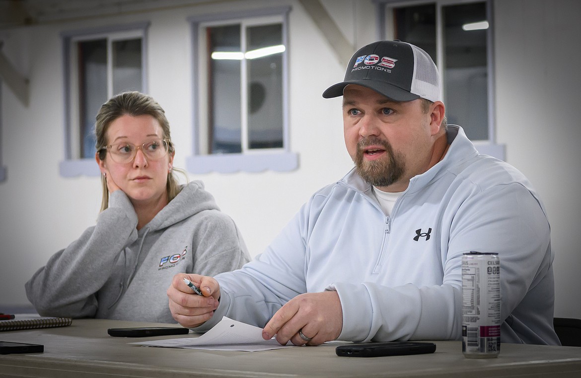 406 Promotions owner Tim Denson and assistant Breanna Denson discuss their updated Sanders County Fair demolition derby bid. (Tracy Scott/Valley Press)