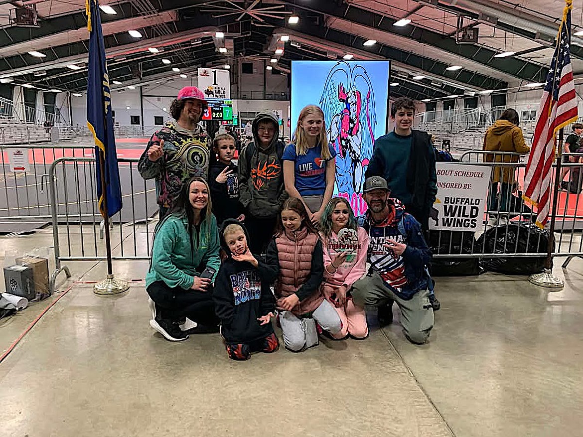 Members of the Mizfitz Wrestling Club, from left, back row, are coach Dakota Bassett, Ryan Masters, James Masters, Alyson Young and Gabe Bassett. From left, front row, are coach Brittanie Bassett, Hudson Mohr, Zuri Bassett, RaeLynn Masters and coach RJ Masters. (Courtesy photo)