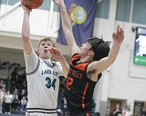 PREP BOYS BASKETBALL: An interesting ending ... Lake City downs IEL-leading Post Falls, but Trojans keep tiebreaker late