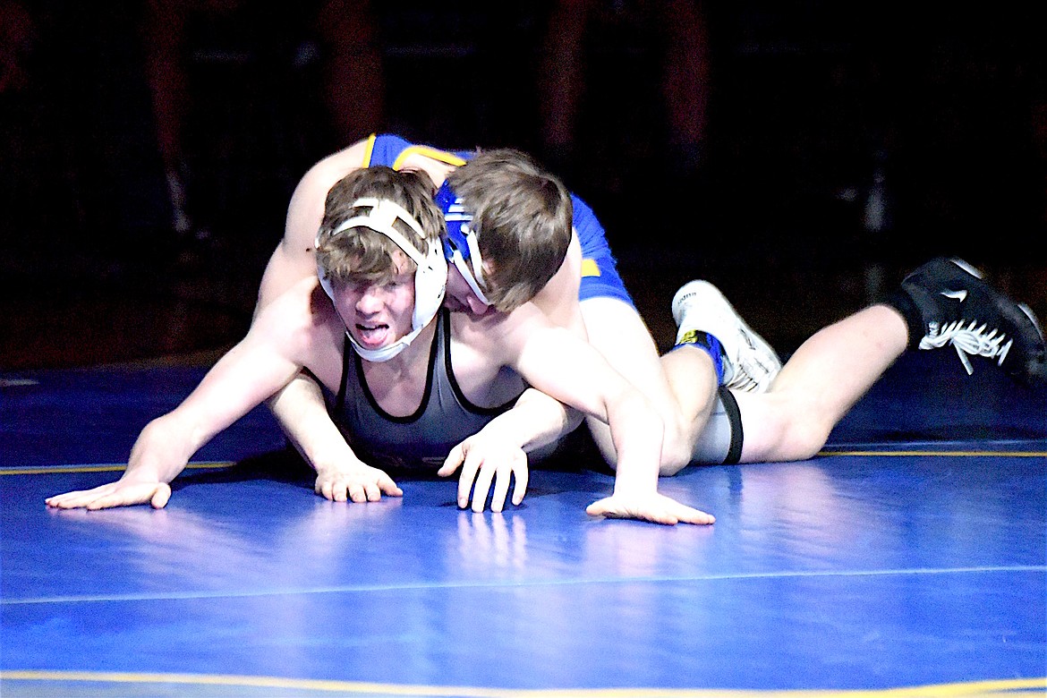 Libby Greenchain wrestler Connor Benson has Polson's Jaspin Fisher under control before pinning him in 55 seconds Thursday, Jan. 30, 2025. (Scott Shindledecker/The Western News)