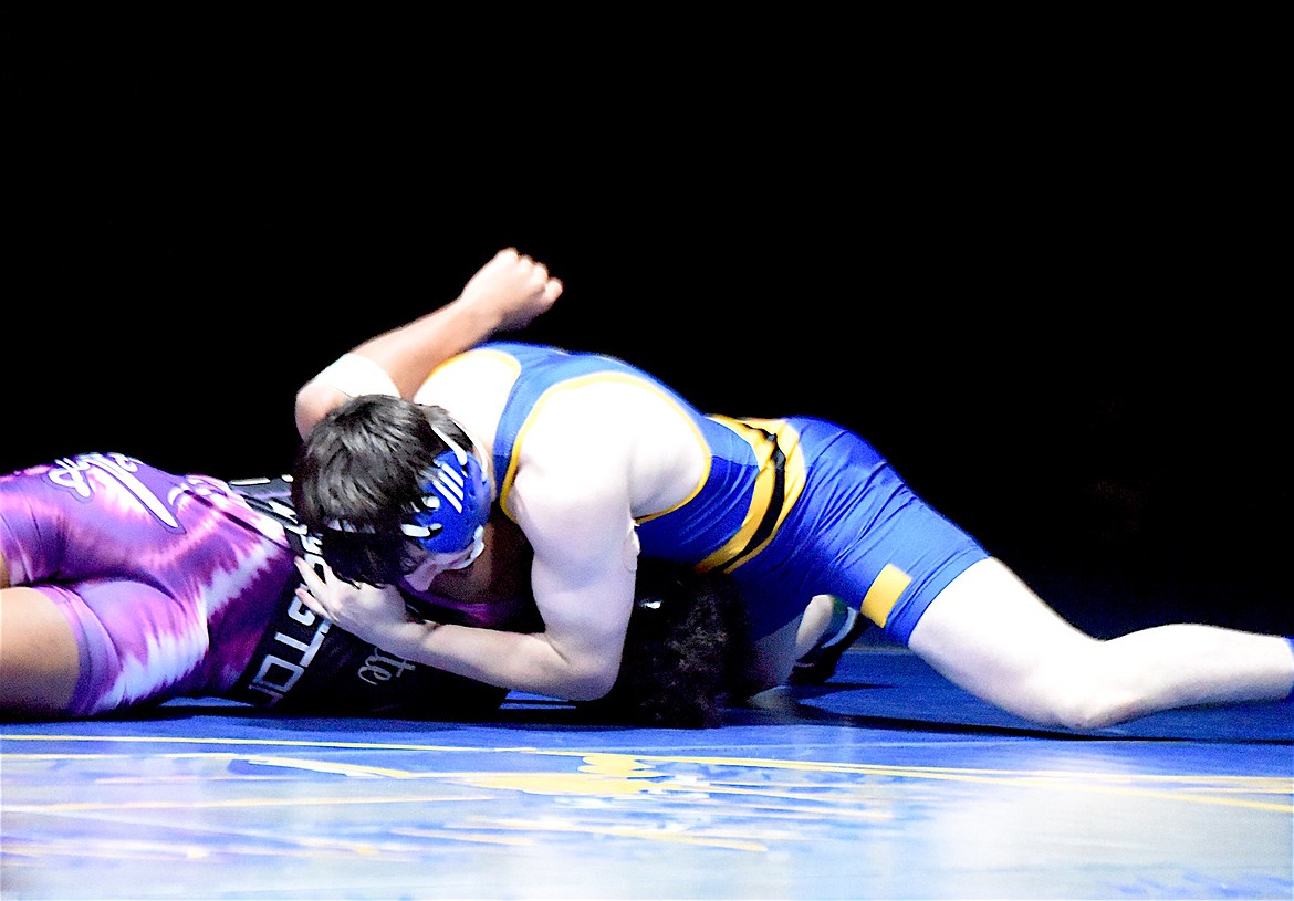 Libby Greenchain wrestler Hunter Rooney pinned Polson's Gabriel Houston Thursday, Jan. 30, 2025. (Scott Shindledecker/The Western News)