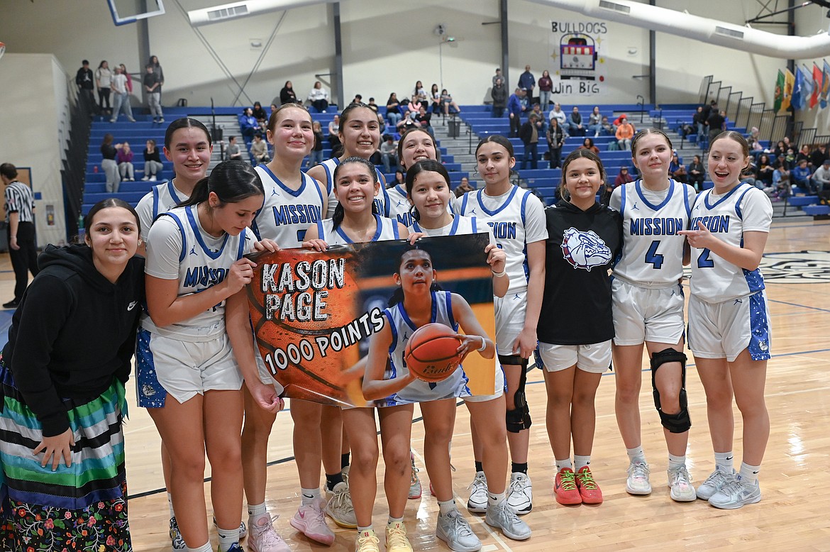 Mission's Kason Page celebrates her 1,000th point, surpassed during last Friday's triumphant game against Anaconda. (Christa Umphrey photo)