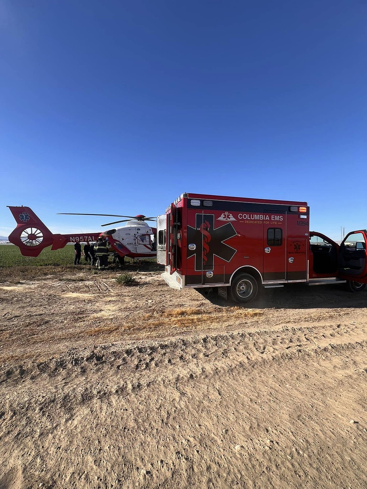 Columbia EMS crews help transfer a patient in the field in fall 2024. Emergency medical services in the Quincy Valley are the subject of a study commissioned by local emergency service providers.