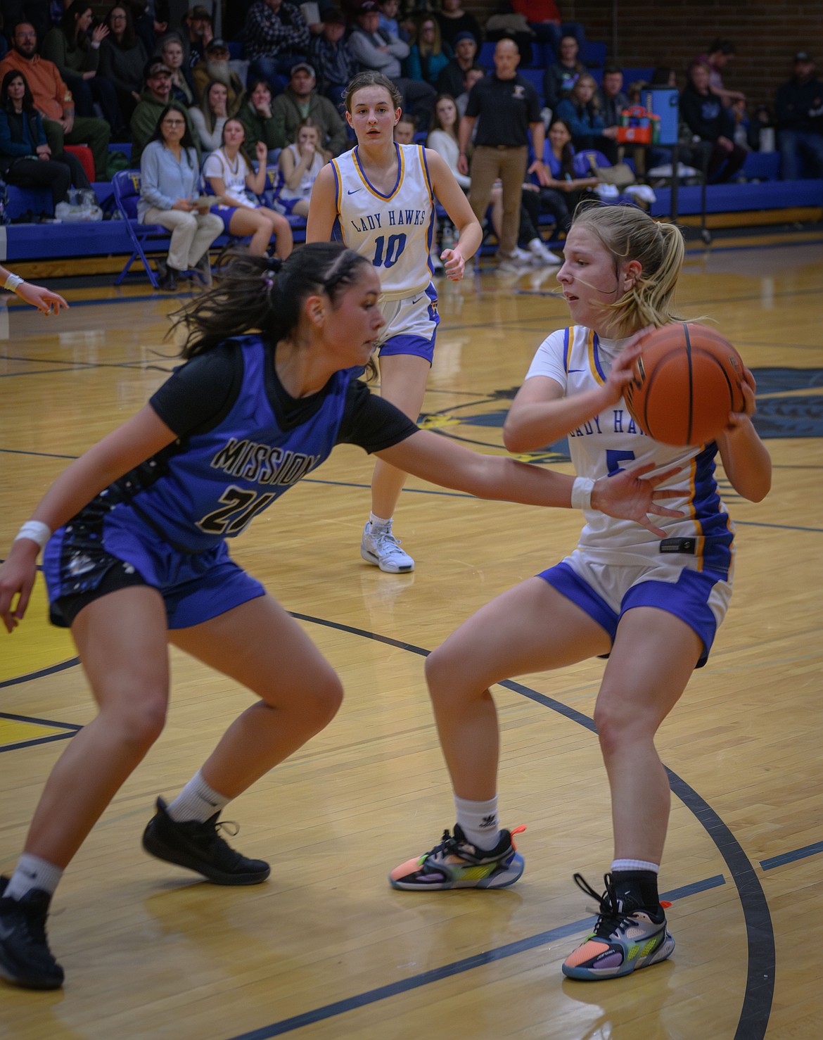 Thompson Falls' Sheadon Kain (with ball) is guarded by St. Ignatius' Brooklyn McClure during their game last Tuesday in T Falls. (Tracy Scott/Valley Press)