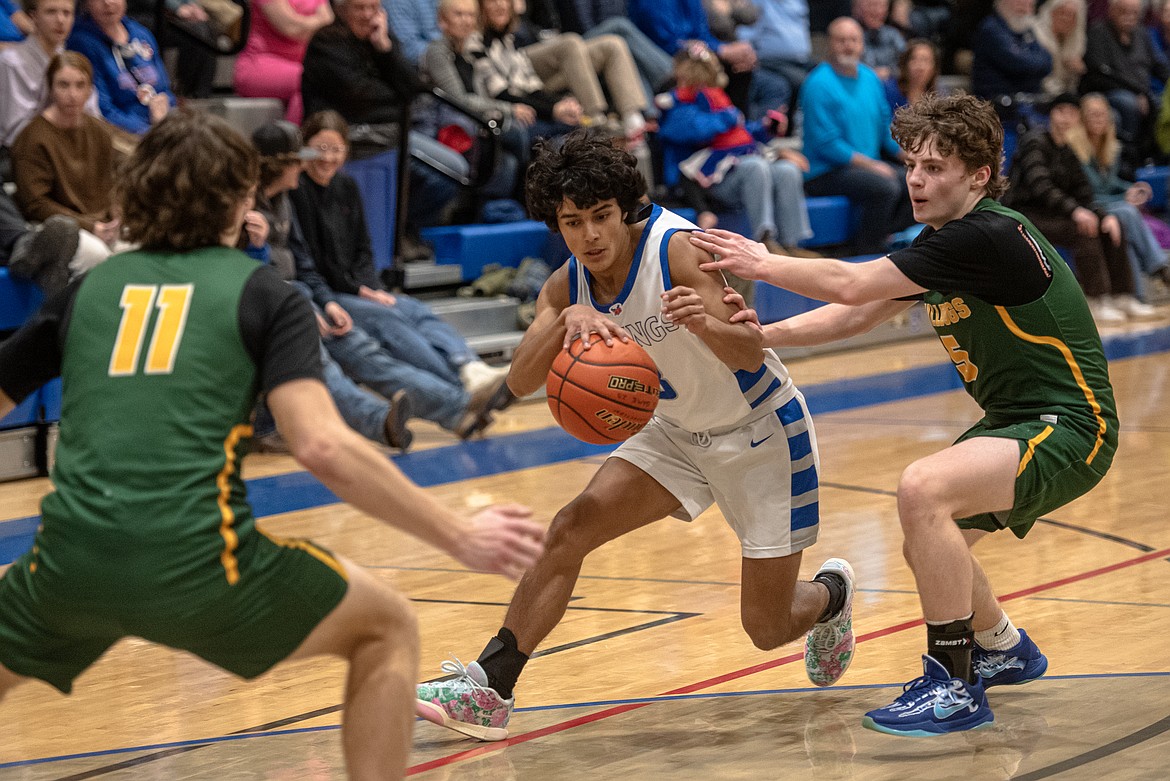 Ryeln Rodriguez takes on Whitefish's defense Thursday night. (Avery Howe/Bigfork Eagle)