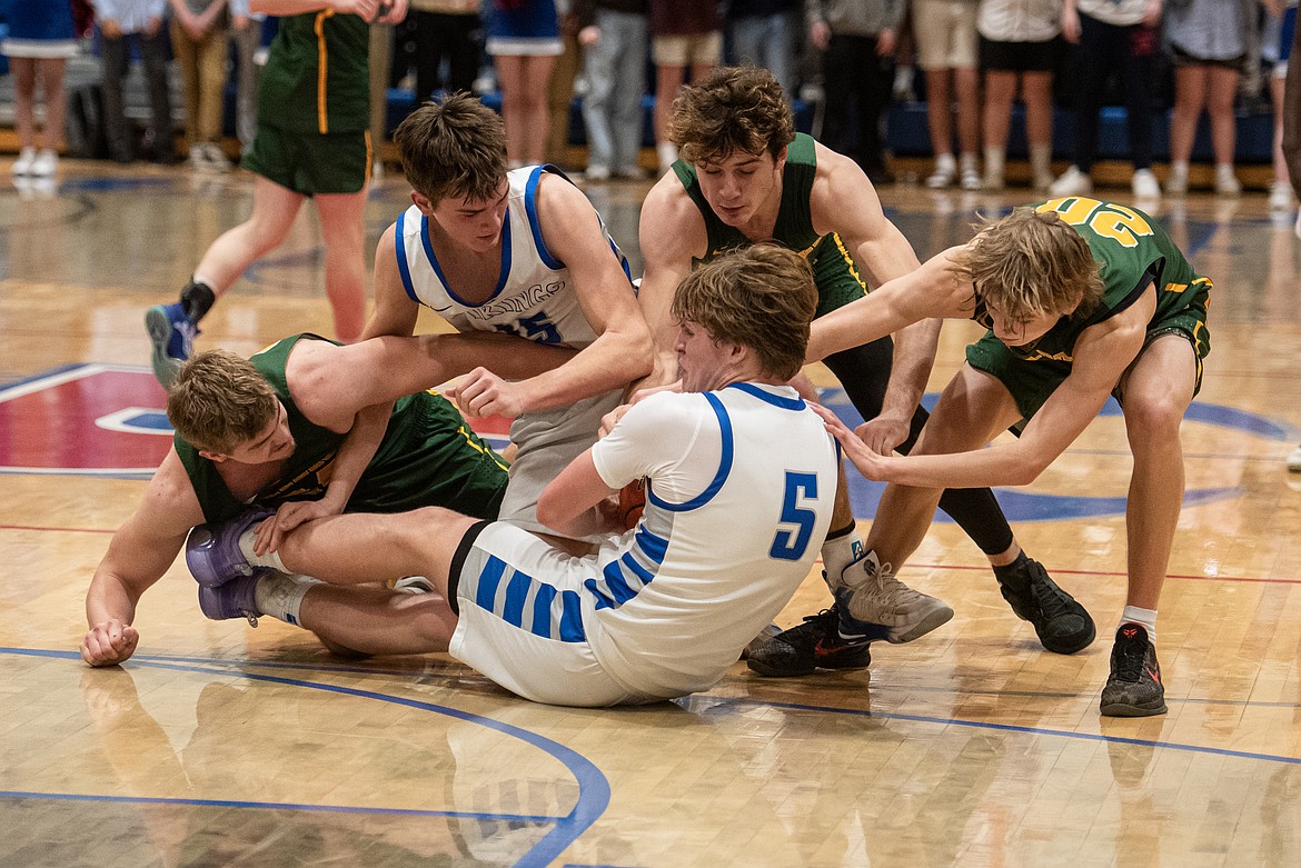 Vikings Austin Savik and Quinn Herring wrestle Whitefish for control of the ball Thursday night. (Avery Howe/Bigfork Eagle)