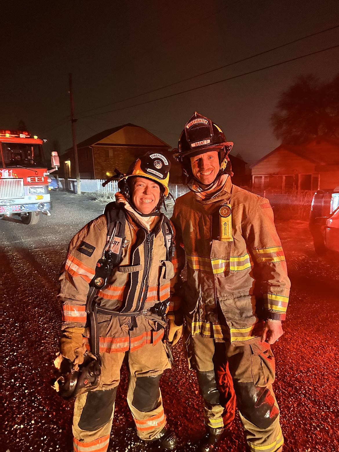 CW, right, and Emily Forrest pause for a photo after the first fire they fought together, an RV blaze.