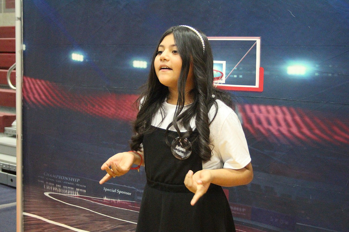 Aileen Avalos, Wahluke Junior High, explains the details of basketball during the Amazing Shake in Mattawa Tuesday.